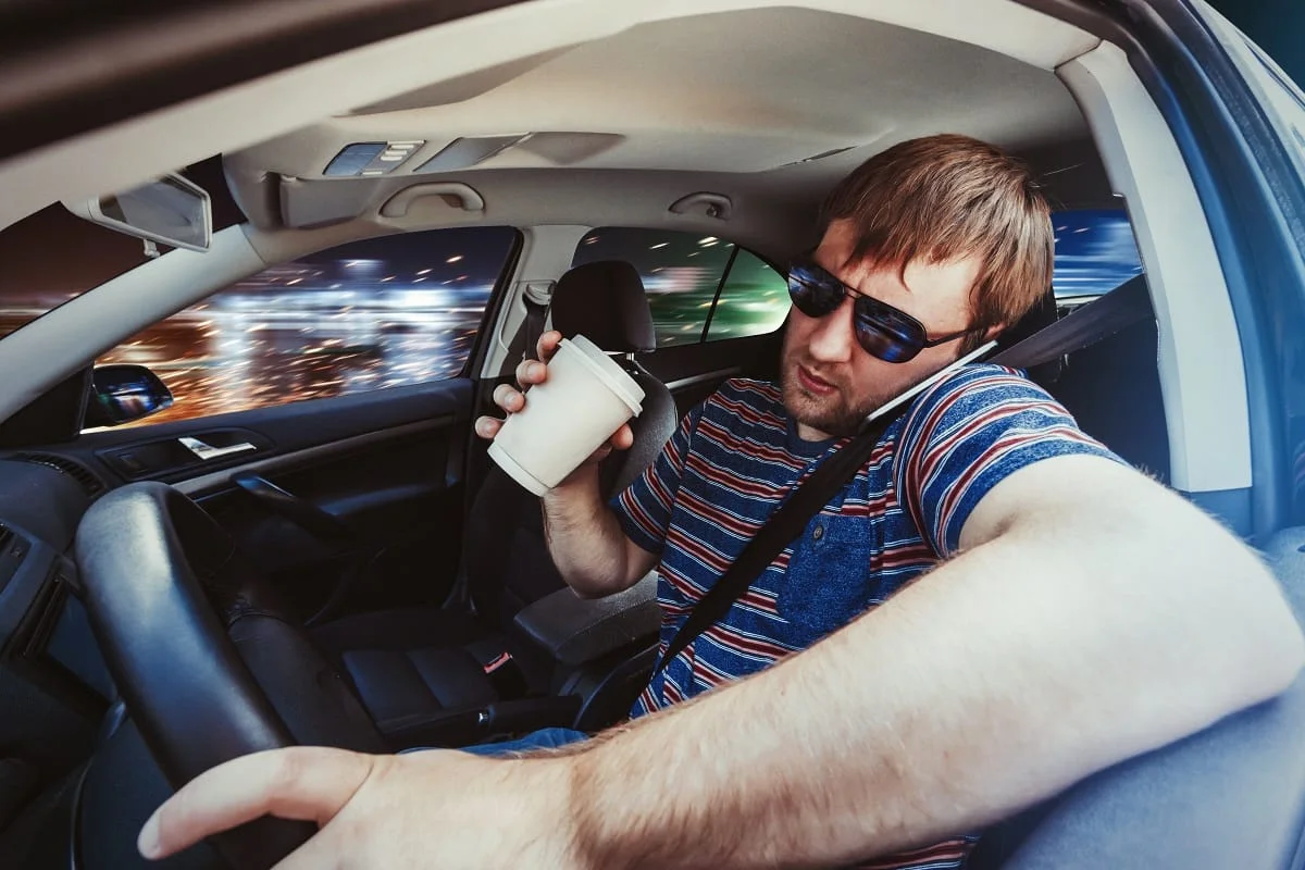 Distracted-driving-driver-phone-coffee