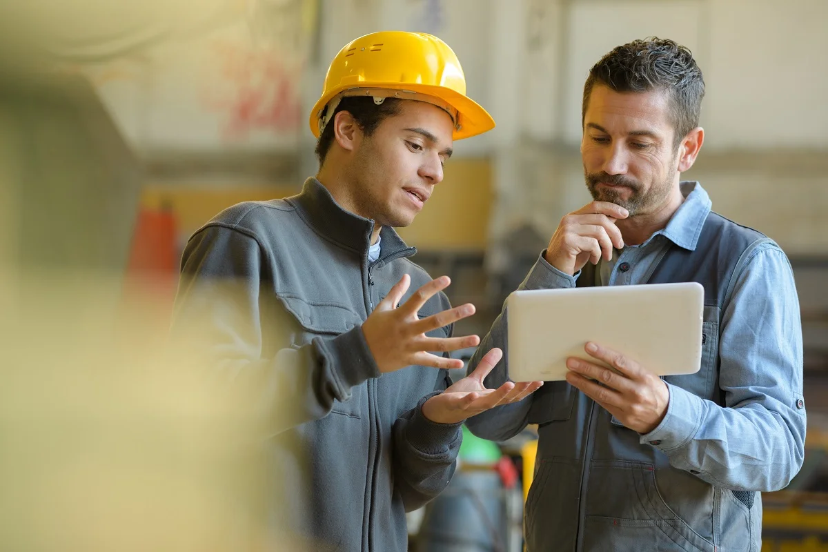 boss and worker checking results on the tablet