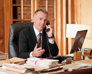 An attorney speaking on the phone.