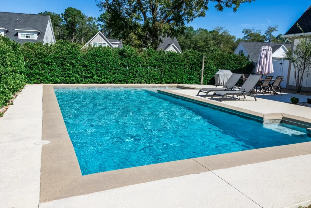A backyard inground swimming pool.