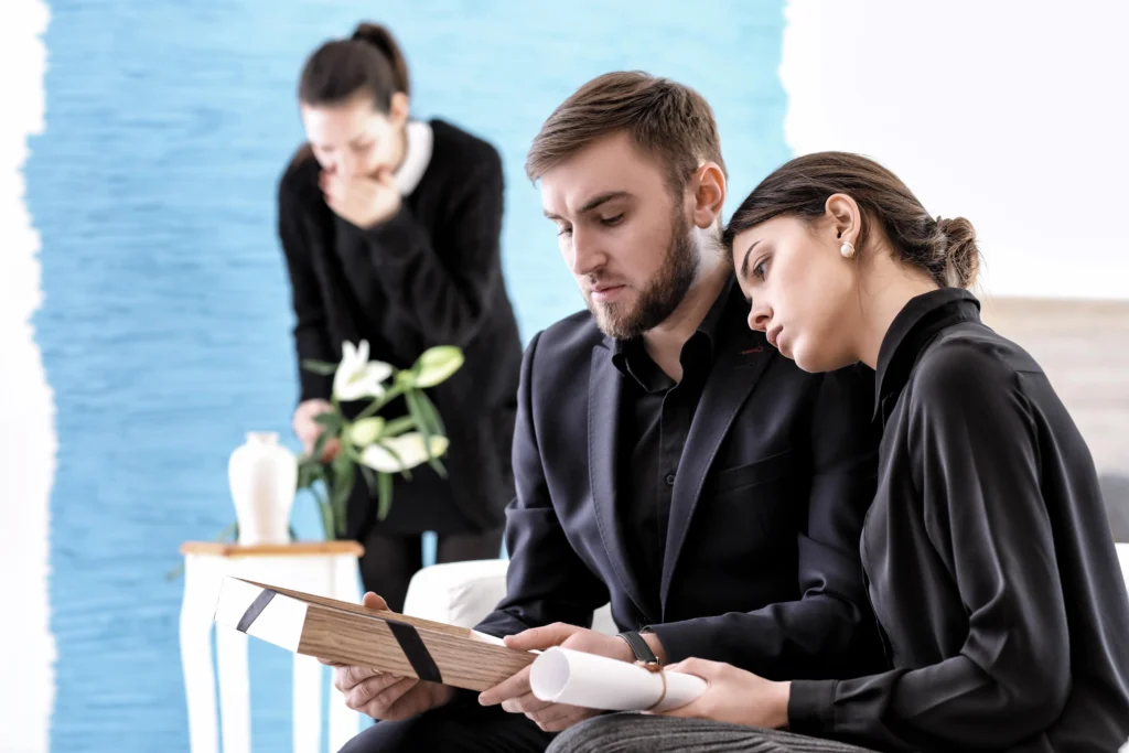 A couple at a funeral.