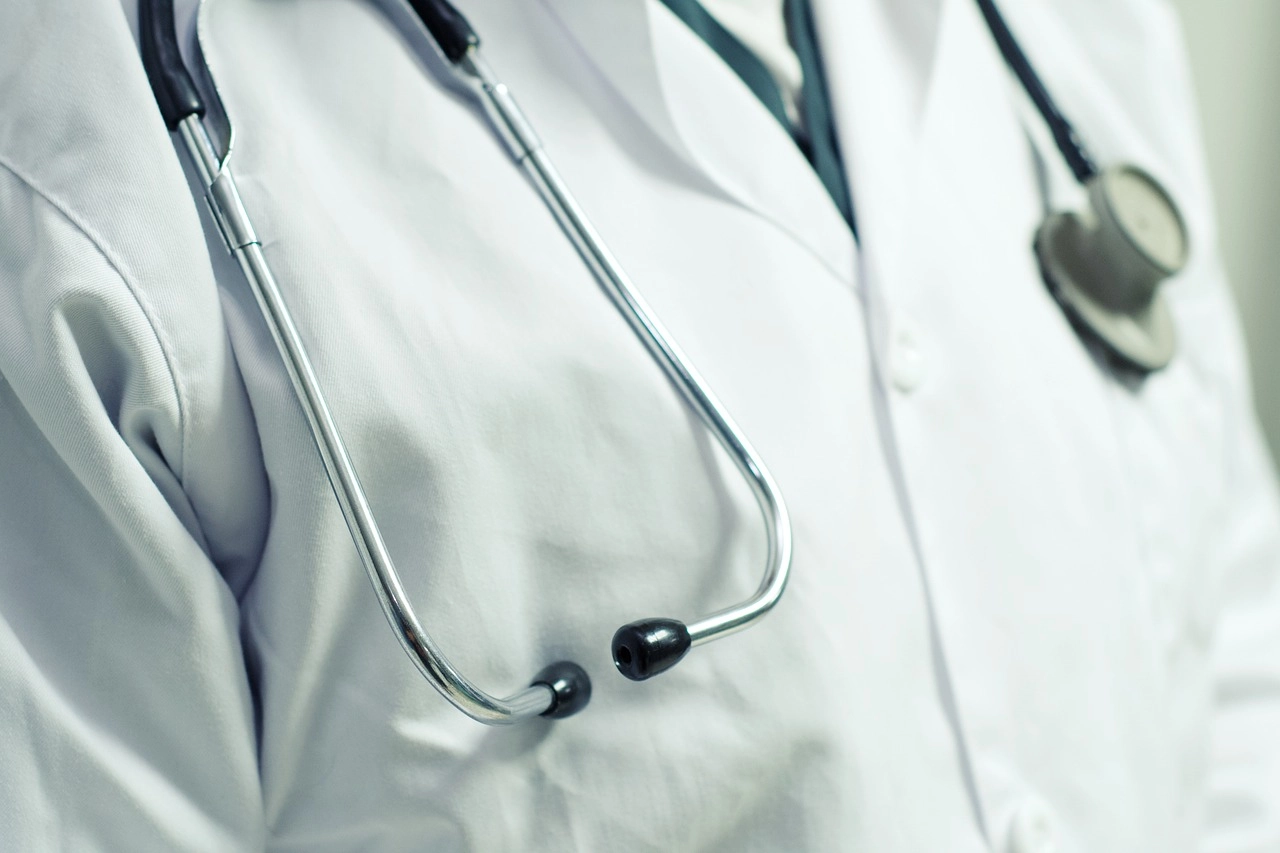A close up of a doctor's coat and stethoscope