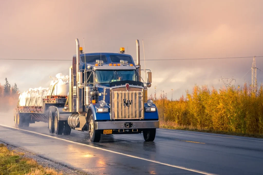 A commercial truck driving down a highway.